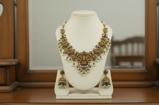 Decorative necklace on a white stand with a plain background