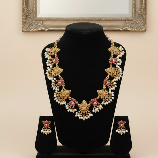 Antique gold temple necklace and earring set with red lotus stones and pearl hangings by House of Abiani