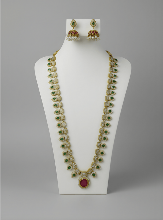 Jewelry set with necklace and earrings on a white stand against a gray background