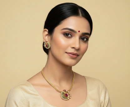 Gold necklace and earrings held in a hand with 'Nk-30' label in the corner.