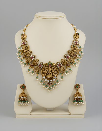 Decorative necklace on a white stand with a plain background