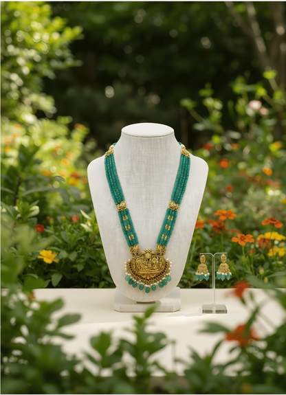 Bead Necklace set on a stand with a scenic background