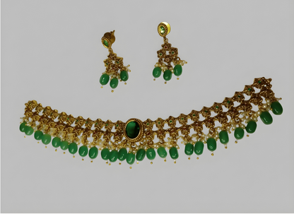 Jewelry set with necklace and earrings on a light gray background