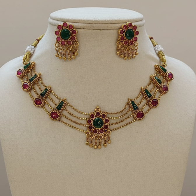 Jewelry set including a necklace and earrings on a white mannequin bust.