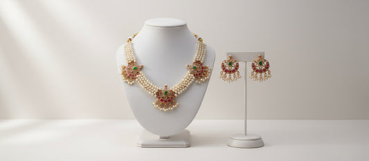 Jewelry set with necklace and earrings on a gray background