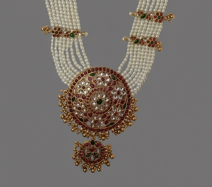 Ornate necklace with intricate design on a gray background