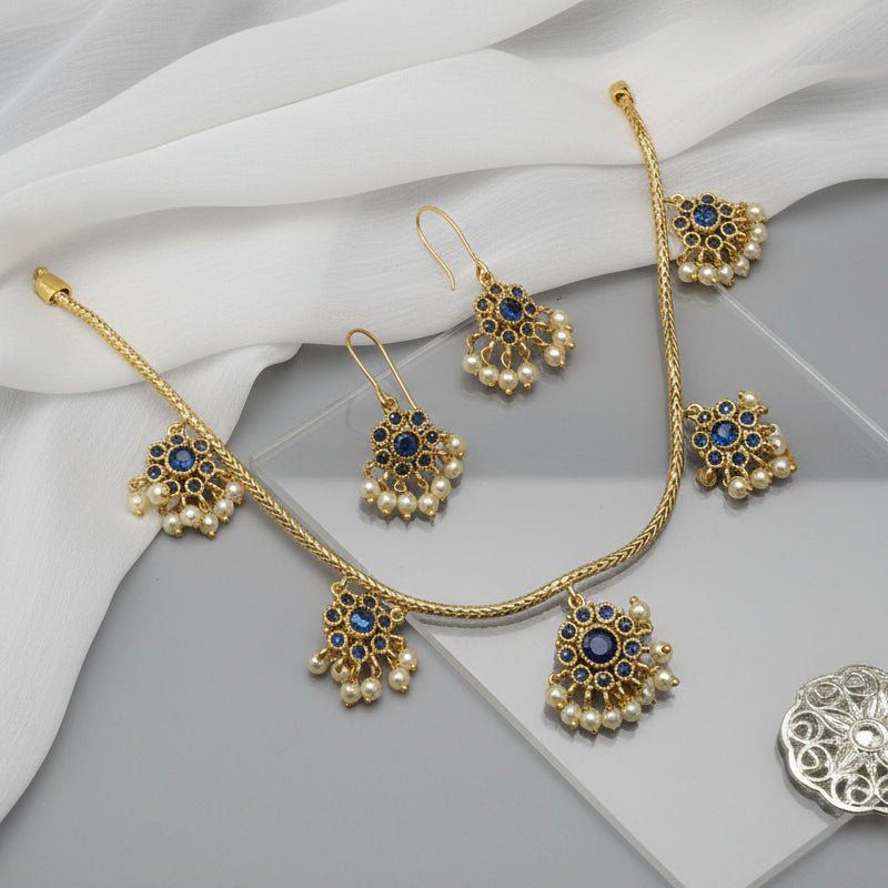 antique gold necklace with blue kemp stone floral drops and pearl detailing, finished with matching floral drop earrings