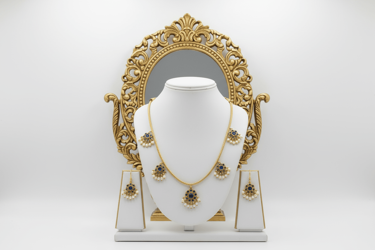 antique gold necklace with blue kemp stone floral drops and pearl detailing, finished with matching floral drop earrings