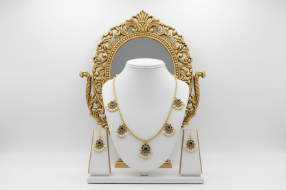 antique gold necklace with blue kemp stone floral drops and pearl detailing, finished with matching floral drop earrings