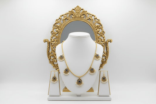 antique gold necklace with blue kemp stone floral drops and pearl detailing, finished with matching floral drop earrings