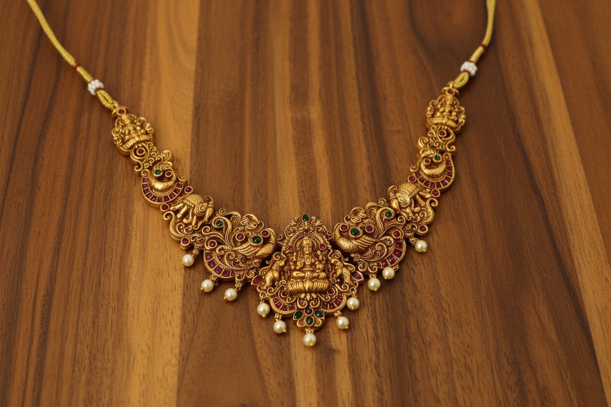 This exquisite handcrafted gold necklace set embodies the grandeur of South Indian temple jewelry.