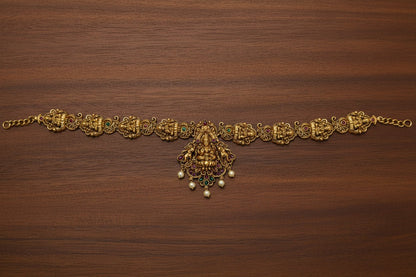 This exquisite handcrafted gold necklace set embodies the grandeur of South Indian temple jewelry.