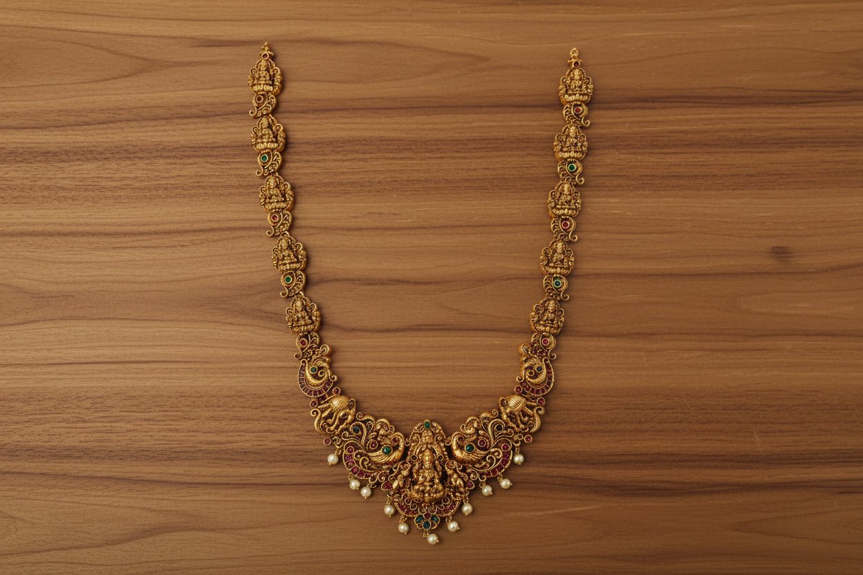 This exquisite handcrafted gold necklace set embodies the grandeur of South Indian temple jewelry.
