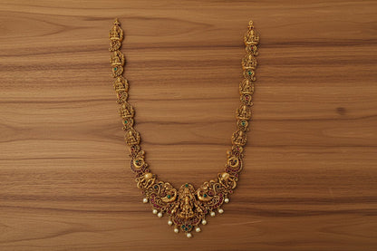 This exquisite handcrafted gold necklace set embodies the grandeur of South Indian temple jewelry.