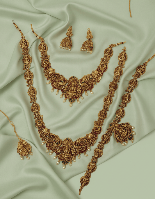 This exquisite handcrafted gold necklace set embodies the grandeur of South Indian temple jewelry.