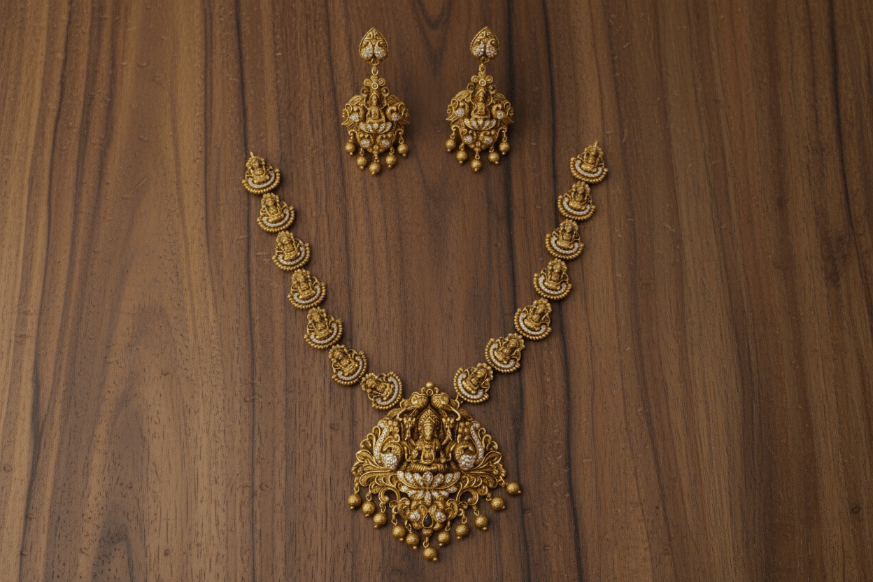 Lakshmi-peacock pendant set in antique gold finish, featuring white stone inlay and gold bead hangings.