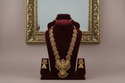 Celebrate timeless tradition with this temple jewelry set, featuring a majestic necklace and matching earrings.