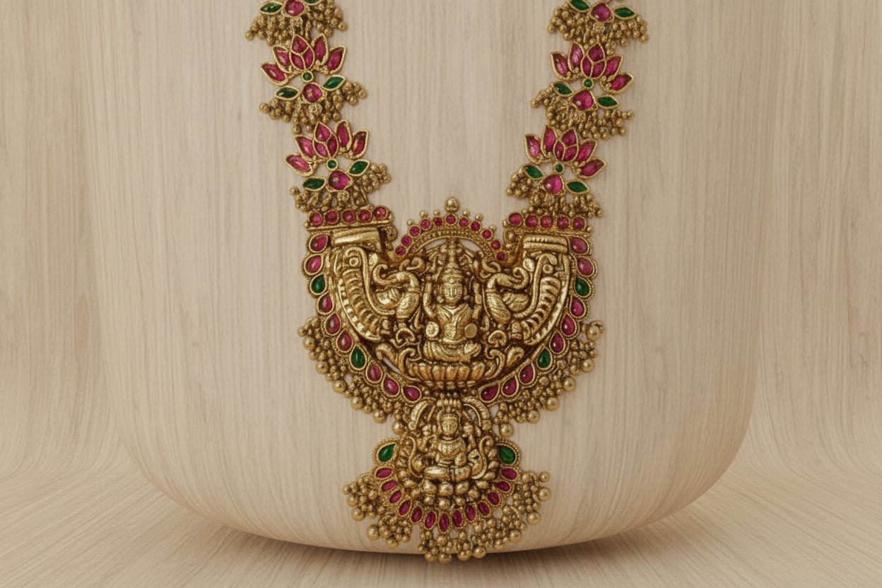 Celebrate timeless tradition with this temple jewelry set, featuring a majestic necklace and matching earrings.